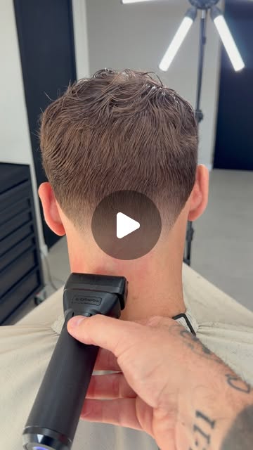 Sean demonstrating a neck taper with clippers